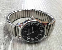 Montre extensible pour femmes fond noir