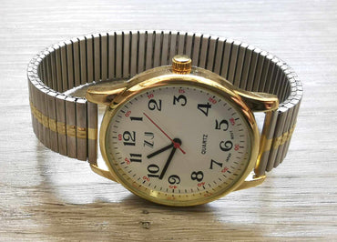 Montre avec bracelet extensible deux tons (or et argent)