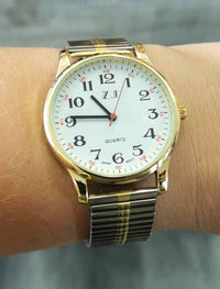 Montre avec bracelet extensible deux tons (or et argent)