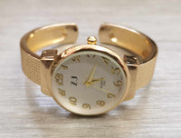 Montre bangle femme ronde or